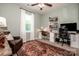 Well-lit bedroom includes a comfortable chair, shelving, desk, and space for working from home at 130 Bay Laurel Dr, Mooresville, NC 28115
