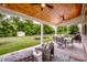 Enjoy the covered patio with ample seating, an outdoor grill, and backyard views at 130 Bay Laurel Dr, Mooresville, NC 28115