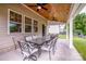 The covered patio features ample seating and ceiling fans, perfect for outdoor entertaining at 130 Bay Laurel Dr, Mooresville, NC 28115