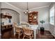 Charming dining room with hardwood floors, a farmhouse-style table, and a cozy ambiance at 130 Bay Laurel Dr, Mooresville, NC 28115