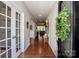 Elegant entryway featuring hardwood floors, French doors, and a welcoming wreath on the front door at 130 Bay Laurel Dr, Mooresville, NC 28115
