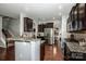 Spacious kitchen boasts dark cabinets, stainless steel appliances, and granite countertops at 130 Bay Laurel Dr, Mooresville, NC 28115