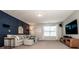 Relaxing living room with elegant wall paneling, plush seating, and carpet flooring at 130 Bay Laurel Dr, Mooresville, NC 28115