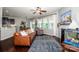 Cozy living room with hardwood floors, a fireplace, and an open concept design at 130 Bay Laurel Dr, Mooresville, NC 28115