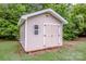 This yard shed has side-by-side doors, a window, and exterior lights at 130 Bay Laurel Dr, Mooresville, NC 28115