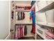 Organized walk-in closet features shelving, hanging rods, luggage, and baskets at 130 Bay Laurel Dr, Mooresville, NC 28115