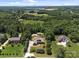 Aerial view of the property showcasing the house, mature trees, and surrounding neighborhood at 14010 Mccord Rd, Huntersville, NC 28078