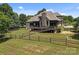 Expansive backyard with a well-maintained lawn and wooded perimeter at 14010 Mccord Rd, Huntersville, NC 28078