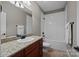 Bathroom with granite vanity, tile floors, and shower over tub with white subway tile at 14010 Mccord Rd, Huntersville, NC 28078