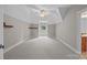 Bright bedroom features unique architecture, neutral paint, ceiling fan, and carpeted floors at 14010 Mccord Rd, Huntersville, NC 28078