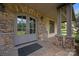 Inviting front porch with stone accents and covered entrance at 14010 Mccord Rd, Huntersville, NC 28078