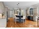 Gourmet kitchen with custom cabinets, a granite island, and hardwood floors for a modern and stylish home at 14010 Mccord Rd, Huntersville, NC 28078