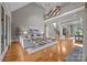 Elegant living room boasting high ceilings, hardwood floors, and a grand staircase for luxurious living at 14010 Mccord Rd, Huntersville, NC 28078