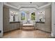 Spacious main bathroom featuring double vanities, a garden tub, and decorative tile at 14010 Mccord Rd, Huntersville, NC 28078