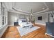 Large main bedroom with hardwood floors, sitting area, and an ensuite bathroom at 14010 Mccord Rd, Huntersville, NC 28078