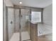 Bright bathroom with a large soaking tub and a separate tiled shower at 15003 Boudins Ln, Charlotte, NC 28278