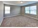 Well-lit bedroom featuring two windows for natural light at 15003 Boudins Ln, Charlotte, NC 28278