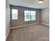 Bedroom with two windows providing natural light at 15003 Boudins Ln, Charlotte, NC 28278