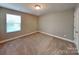 Cozy bedroom with neutral walls and carpet, plus a window for natural light at 15003 Boudins Ln, Charlotte, NC 28278