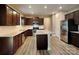 Modern kitchen features granite countertops, stainless steel appliances, and ample cabinet space for storage at 15003 Boudins Ln, Charlotte, NC 28278