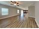 Open living area showcasing modern flooring and a seamless flow into the kitchen, perfect for entertaining at 15003 Boudins Ln, Charlotte, NC 28278