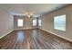 Expansive living room featuring sleek floors and natural lighting, perfect for relaxation and entertaining at 15003 Boudins Ln, Charlotte, NC 28278