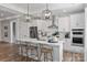 Bright kitchen featuring a large island with seating, stainless steel appliances, and modern pendant lights at 1634 Dresden Dr, Rock Hill, SC 29732