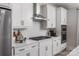 Close up of a modern kitchen with white cabinets, stainless steel appliances, and stylish backsplash at 1634 Dresden Dr, Rock Hill, SC 29732