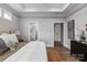 A bright bedroom offers doors to the bathroom and closet and showcases a neutral color palette at 1634 Dresden Dr, Rock Hill, SC 29732