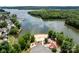 Aerial view of the beach community and lake with a beach and playground at 165 Cardinal Dr # 615, New London, NC 27371