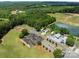 Aerial view of the neighborhood, pond, track, playground and homesites at 165 Cardinal Dr # 615, New London, NC 27371