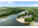 An aerial view of a beach community, waterfront with a parking lot and lake at 165 Cardinal Dr # 615, New London, NC 27371