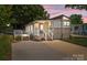 Charming home with a welcoming front porch, a side deck, and a spacious driveway at 165 Cardinal Dr # 615, New London, NC 27371