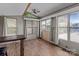 Bright and airy living room featuring wood floors, large windows and a ceiling fan at 165 Cardinal Dr # 615, New London, NC 27371