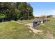 Community recreation area with horseshoe pits and a playground in the background at 165 Cardinal Dr # 615, New London, NC 27371