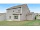 Exterior view of the home showing the vinyl siding and backyard at 165 Clove Hitch Dr # I281, Statesville, NC 28677