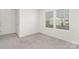 Bright bedroom with carpet, natural light, and neutral tones at 165 Clove Hitch Dr # I281, Statesville, NC 28677