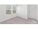 Bright bedroom with carpet, natural light, and neutral tones at 165 Clove Hitch Dr # I281, Statesville, NC 28677