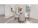 Sunlit dining area featuring a glass table with seating for four at 165 Clove Hitch Dr # I281, Statesville, NC 28677