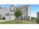 Charming two-story home boasts a well-manicured lawn and an attached two-car garage at 165 Clove Hitch Dr # I281, Statesville, NC 28677
