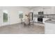 Inviting kitchen with stainless steel appliances, white cabinets, and a sunlit breakfast nook at 165 Clove Hitch Dr # I281, Statesville, NC 28677