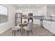 Eat-in kitchen features stainless appliances, granite countertops, and a glass top kitchen table at 165 Clove Hitch Dr # I281, Statesville, NC 28677