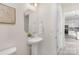 Clean powder room boasts pedestal sink and adjacent kitchen access at 165 Clove Hitch Dr # I281, Statesville, NC 28677