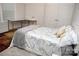 This bedroom features a comfortable bed, closet, and desk for added convenience at 1727 Grace Ln, Charlotte, NC 28262