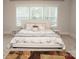 This bedroom features a bright window and a comfortable bed, creating a peaceful atmosphere at 1727 Grace Ln, Charlotte, NC 28262
