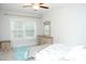Bright bedroom featuring a ceiling fan, bedside table and a well-lit window at 1727 Grace Ln, Charlotte, NC 28262