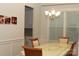 Elegant dining room featuring classic chandelier lighting and a traditional dining set at 1727 Grace Ln, Charlotte, NC 28262