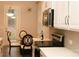 Bright kitchen featuring stainless steel appliances, white cabinetry, and a cozy breakfast nook at 1727 Grace Ln, Charlotte, NC 28262