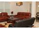 Cozy living room showcasing a leather sofa set, coffee table, and a decorative area rug at 1727 Grace Ln, Charlotte, NC 28262