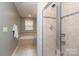 Beautiful bathroom with tiled glass shower and separate tub at 1809 Evergreen Dr, Charlotte, NC 28208